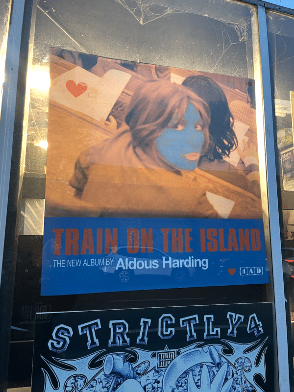 Aldous Harding's latest album is advertised in a window at Wax Trax on 13th Street in Denver (Photo: John Cargile)